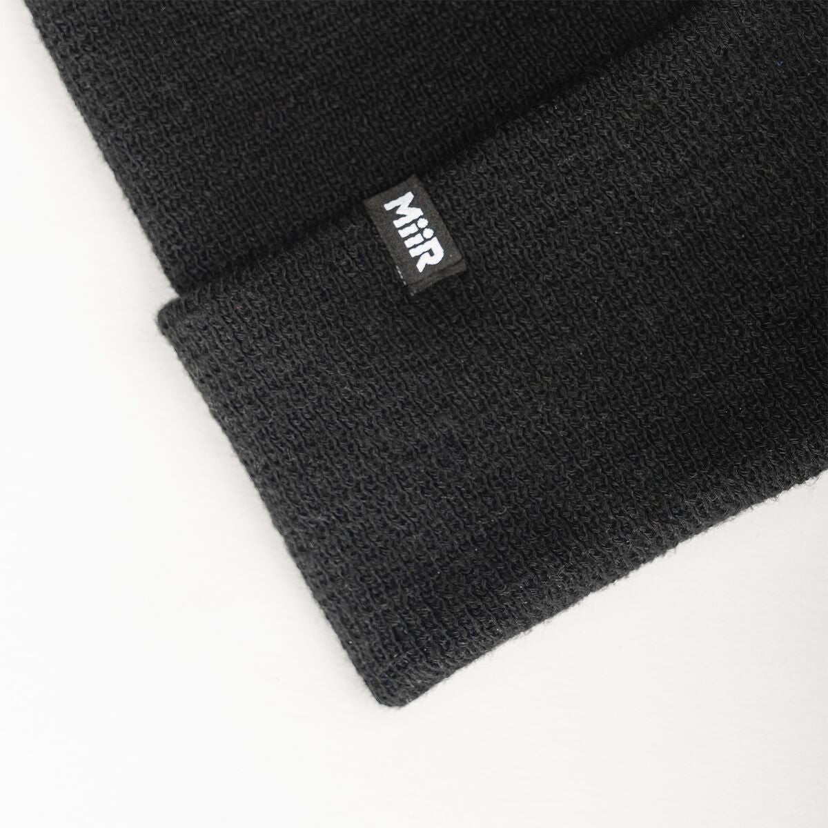 recycled-poly-fine-knit-beanie-x3 WebPDP-RecycledPolyFineKnitBeanie_Studio_TagDetail_Black__BNE005002OS.jpg