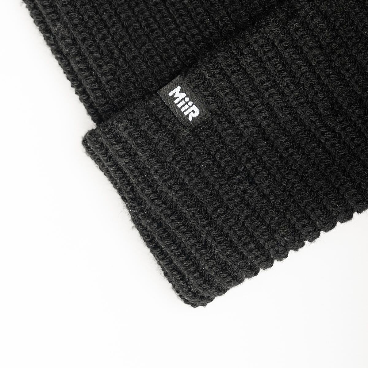 recycled-poly-rib-beanie-g4 WebPDP-RecycledPolyRibBeanie_Studio_TagDetail_Black__BNE002002OS.jpg